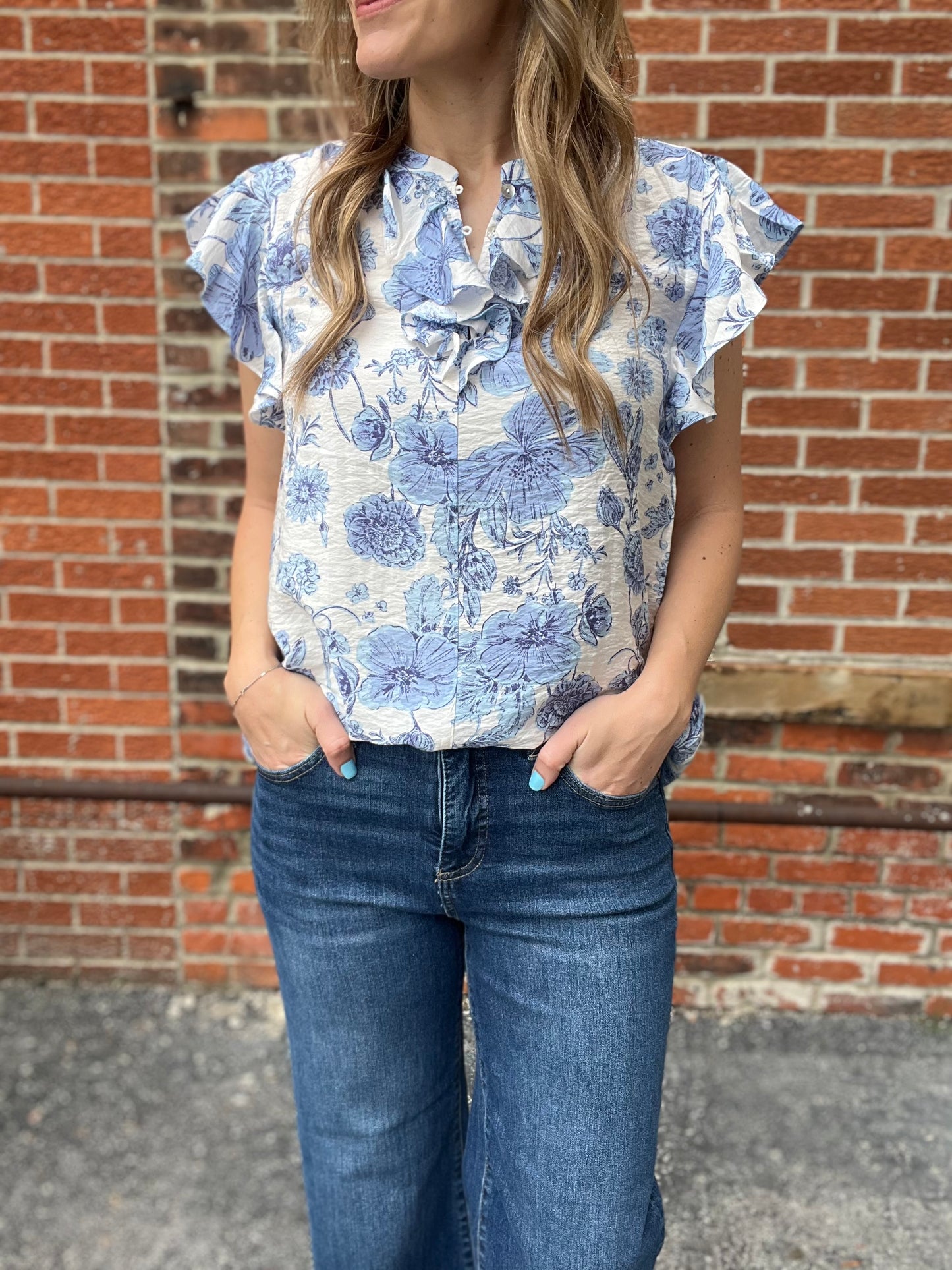 The Kaleigh Blue Floral Ruffle Blouse