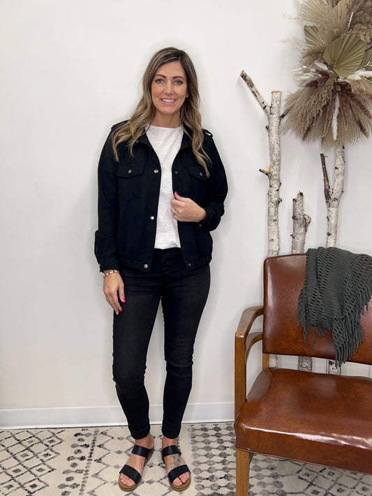 The Kaci Mid Rise Black Label Skinny Jeans