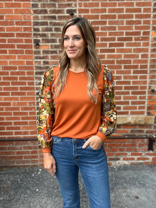 The Ariah Rust Orange Cuff Floral Sleeve Top