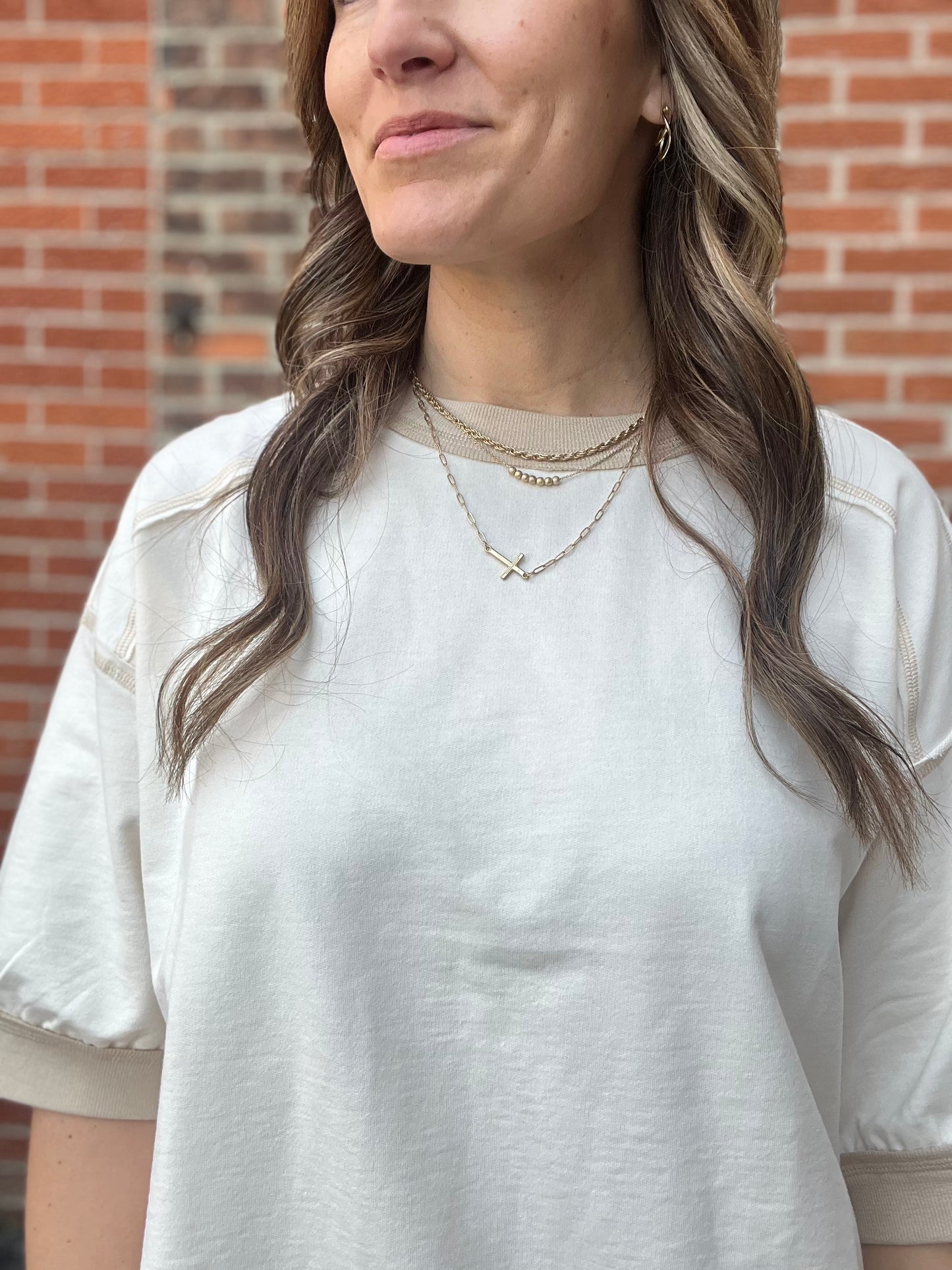 The Sable Cream Contrast Stitch Raglan top