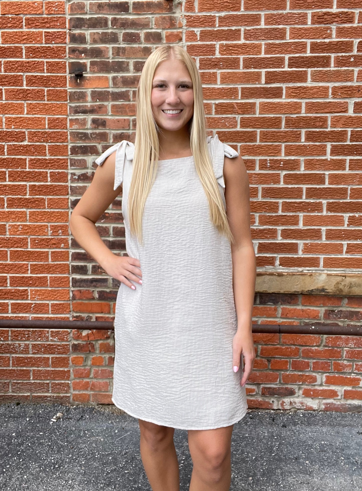 The Calla Sleeveless Shoulder Tie Mini Dress
