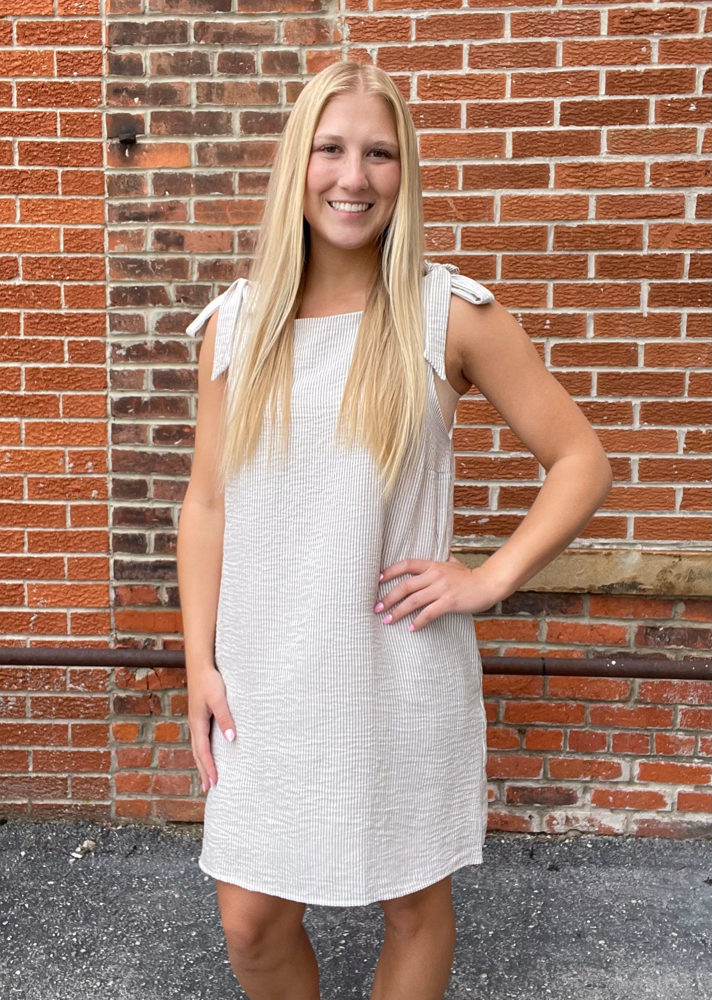 The Calla Sleeveless Shoulder Tie Mini Dress